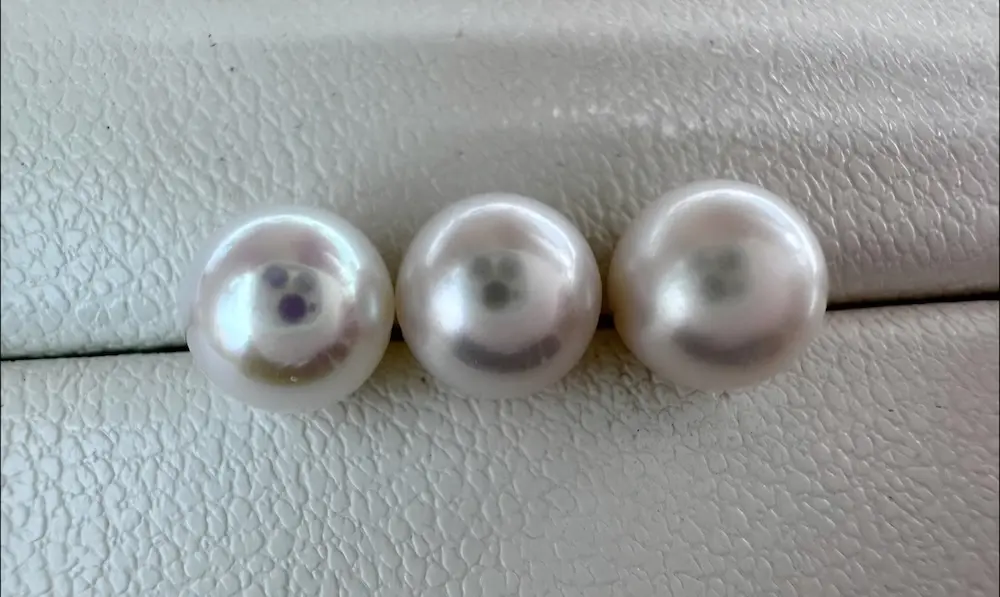 Freshwater Pearl Necklace Wholesale Price: The 2026 Strategic Sourcing Guide 1 Visual comparison pearl luster of freshwater pearl necklace grades